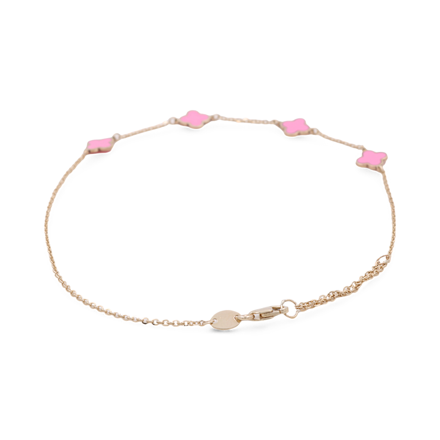 The Miral Jewelry Yellow Gold 14k Fashion Ankle Bracelet is a delicate ankle accessory featuring small pink clover-shaped charms and a secure lobster clasp.