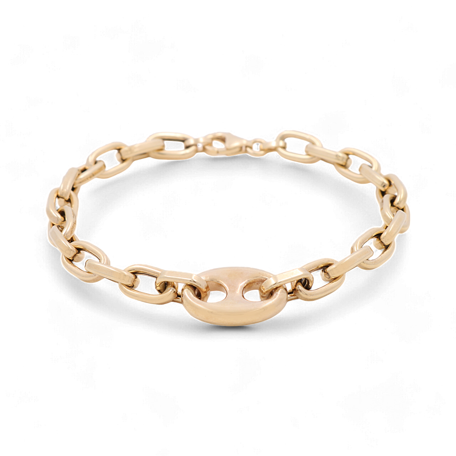 An elegant accessory from Miral Jewelry, the 14K Yellow Gold Fashion Links Bracelet showcases interlocking chain links in both yellow and white gold, highlighted by a central oval link, all beautifully displayed on a white background.