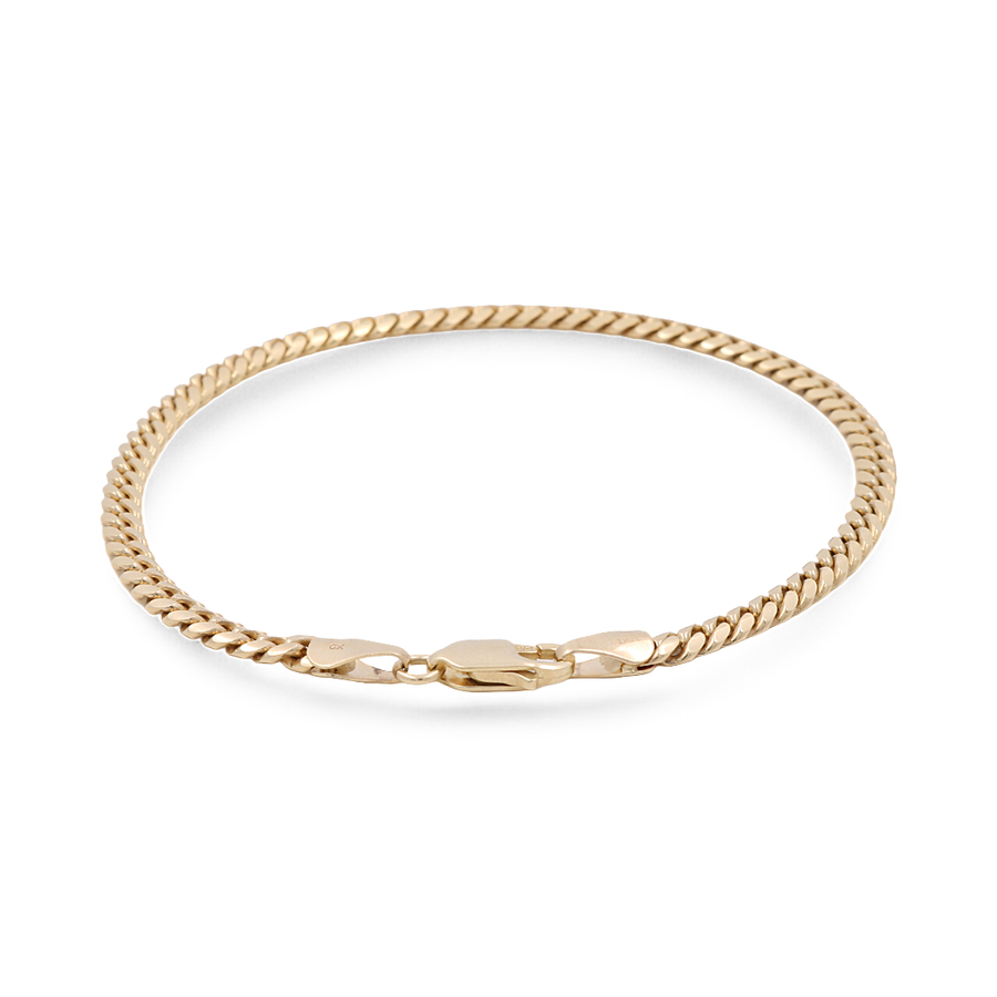 A close-up of the Miral Jewelry 14K Yellow Gold Women's Fashion Cuban Link Bracelet, featuring a flat curb link design and a lobster clasp, perfect for Italian-inspired elegance.