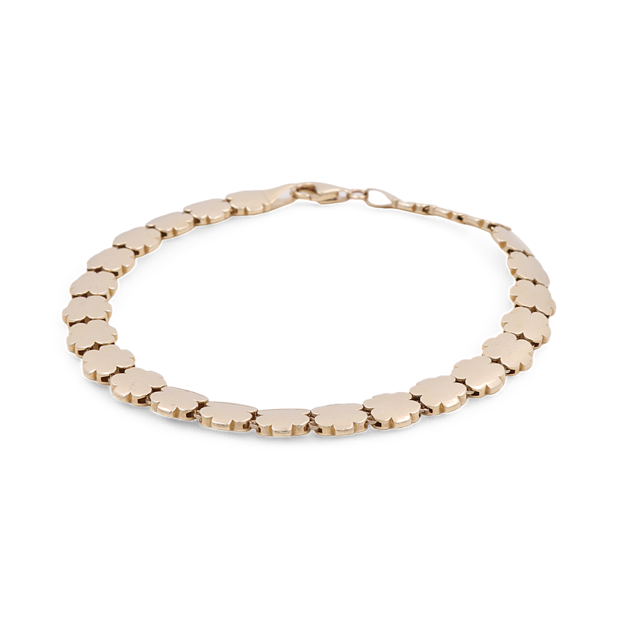 A luxury jewelry piece, the Miral Jewelry 14K Yellow Gold Women's Flowers Fashion Link Bracelet features interlocking clover-shaped links and a secure clasp, making it a stunning addition to any women's fashion link bracelet collection.