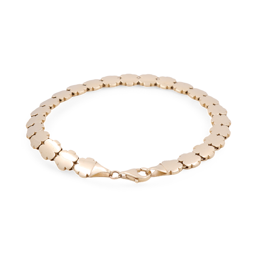 The Miral Jewelry 14K Yellow Gold Women's Flowers Fashion Link Bracelet features a series of interlocking floral-shaped links and a lobster clasp closure on a white background, epitomizing luxury jewelry in women's fashion.