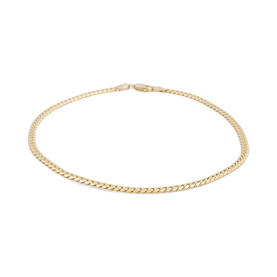 Introducing the Miral Jewelry 14K Yellow Gold Women's Fashion Cuban Link Ankle Bracelet, showcasing a sleek flat link design and embellished with sparkling CZ stones, complete with a secure clasp closure.