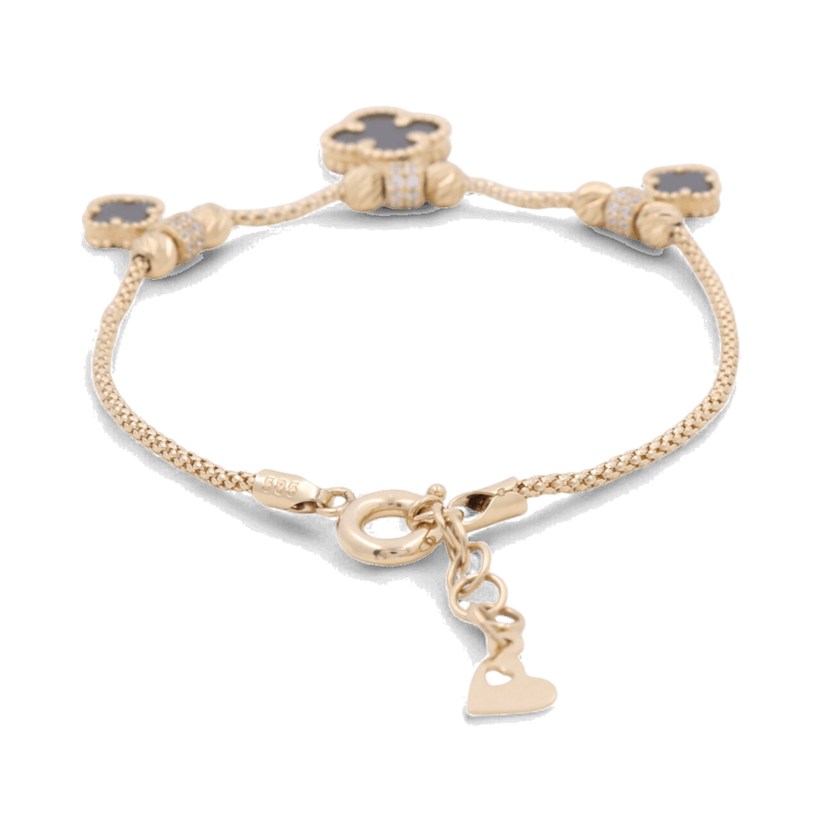 The 14K Gold Fashion Women's Fashion Onyx Flowers Bracelet by Miral Jewelry features four dark-colored clover-shaped onyx charms and a small dangling heart charm, making it a perfect addition to any women's fashion bracelet collection.