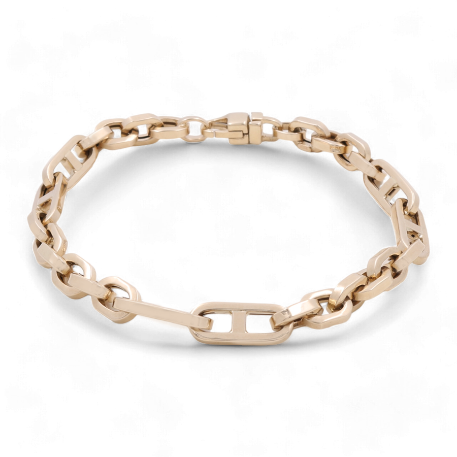 The Miral Jewelry 14K Yellow Gold Fashion Links Bracelet, featuring rectangular and oval-shaped links arranged in a continuous loop, exudes timeless elegance.