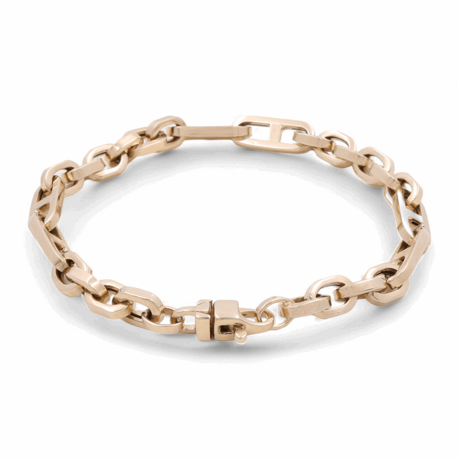 The 14K Yellow Gold Fashion Links Bracelet by Miral Jewelry exudes timeless elegance with its interconnected links and secure clasp.