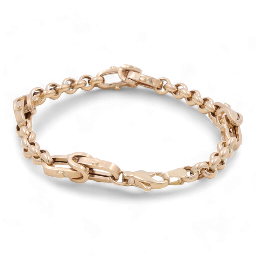 This stunning 14K yellow gold bracelet by Miral Jewelry features alternating Italian link designs, exuding elegance and sophistication.