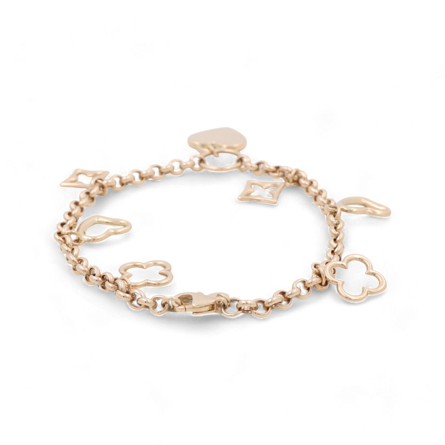 Introducing the 14K Gold Fashion Women’s Flowers Beads Bracelet by Miral Jewelry, a stunning piece crafted from 14K gold. This exquisite accessory features a chain adorned with various shaped charms, including a clover, diamond, teardrop, and a small heart charm near the clasp. Delicate cubic zirconias further enhance its elegance, making it a perfect addition to any jewelry collection.