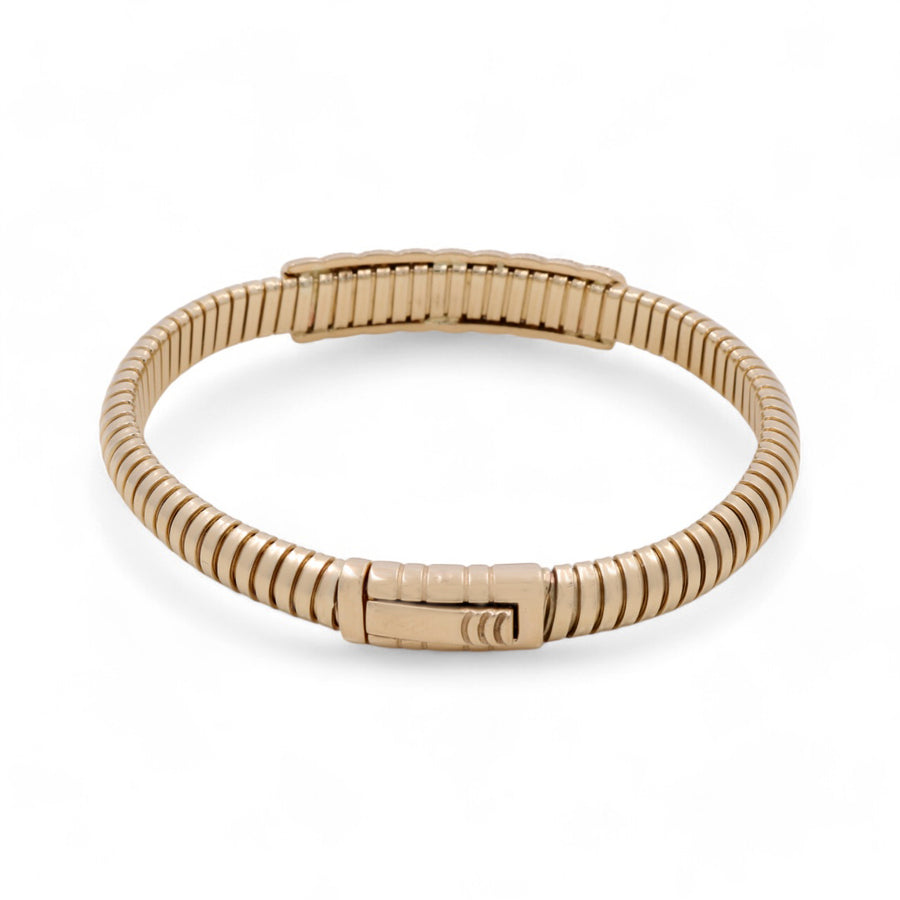 Miral Jewelry's 14K Gold Fashion Women's Bracelet with Cubic Zirconias features a gold-toned, flexible design and a rectangular clasp adorned with cubic zirconias, displayed on a plain white background.