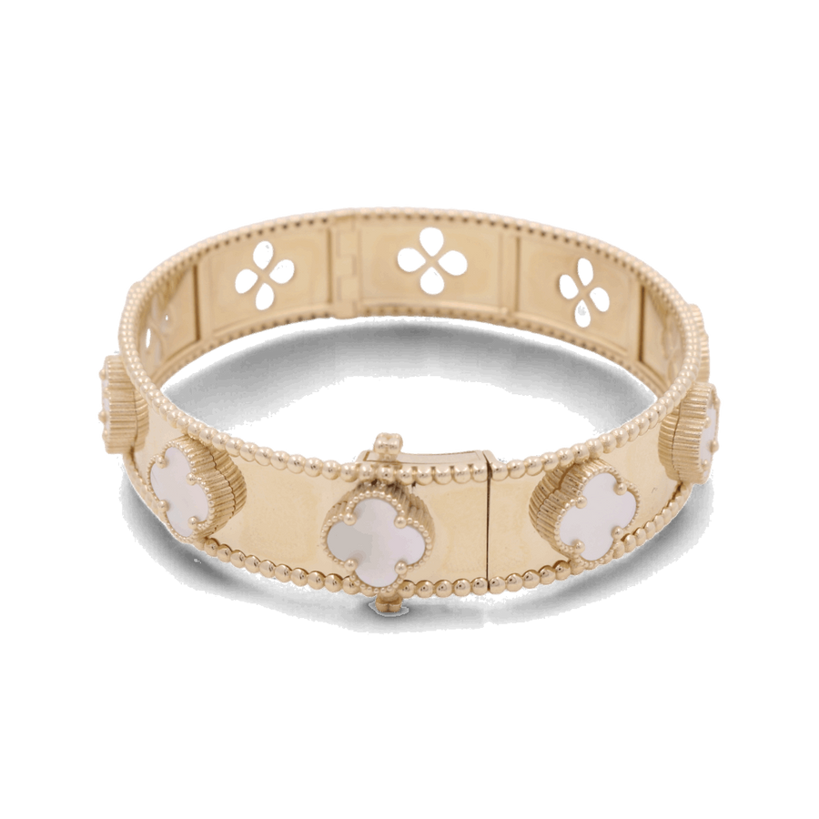 A 14K yellow gold fashion flower women's bracelet from Miral Jewelry, adorned with mother-of-pearl clover-shaped embellishments and a clasp closure, featuring a design of quatrefoil cut-outs along the band.