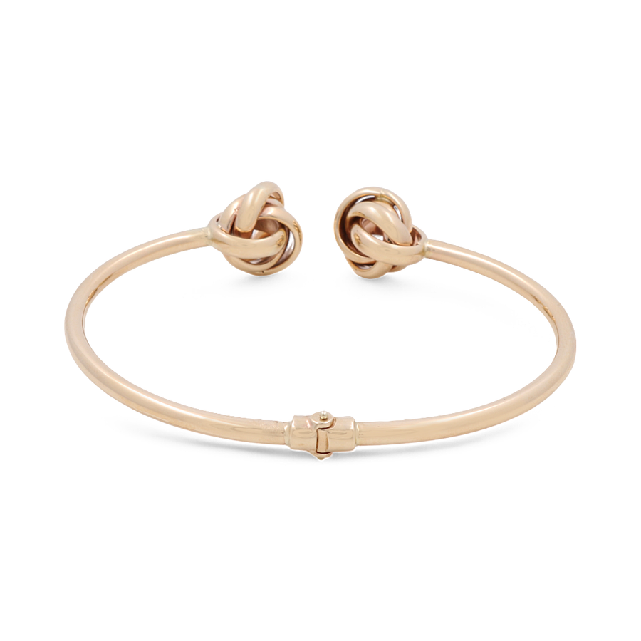 Crafted by Miral Jewelry, the 14K Yellow Gold Fashion Women's Bracelet features two knot-shaped ends and epitomizes fashion jewelry at its finest.