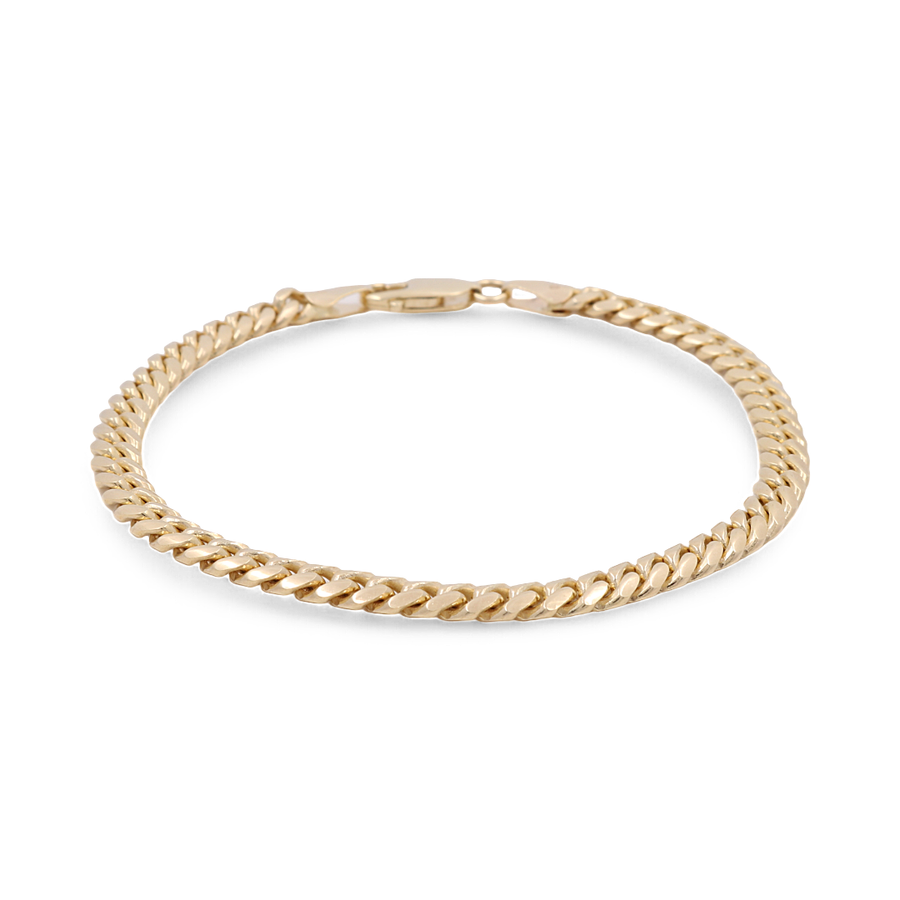 Introducing the Miral Jewelry 14K Yellow Gold Women's Fashion Cuban Link Bracelet, featuring interlocking links and a clasp closure, showcased on a pristine white background – an elegant addition to any woman's fashion collection.