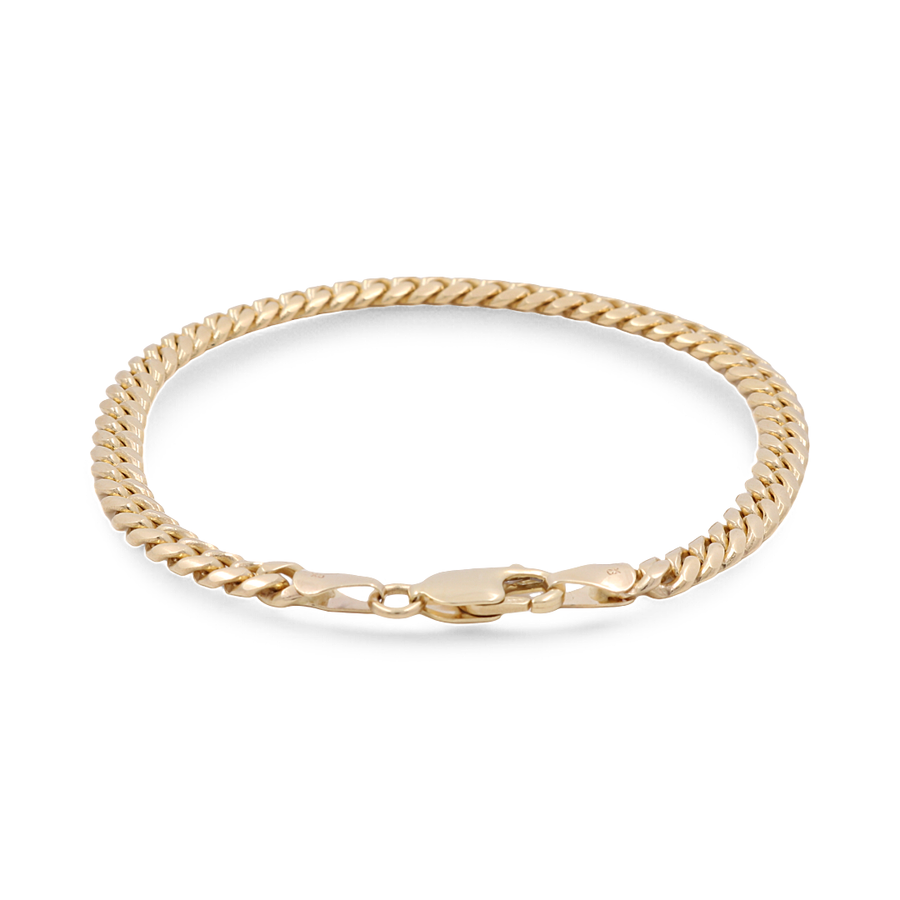 The 14K Yellow Gold Women's Fashion Cuban Link Bracelet by Miral Jewelry features a flat, interlocking design with a secure clasp closure, making it a perfect accessory for women's fashion.