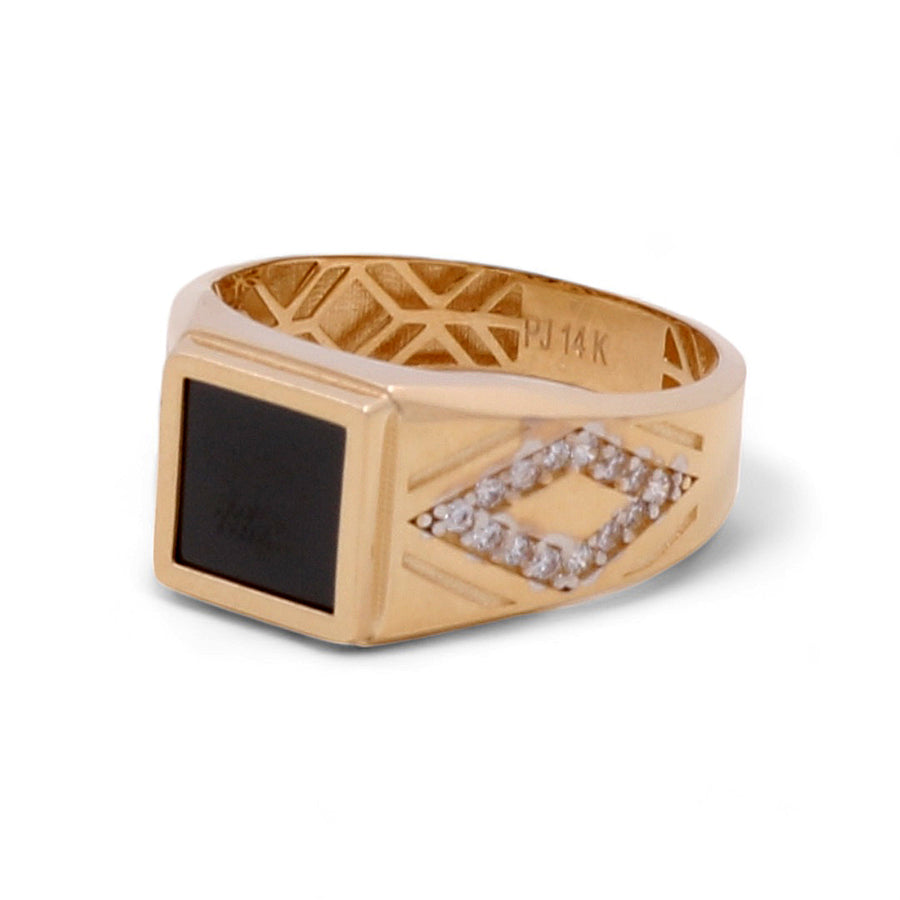 A striking 14K Yellow Gold Men Ring with Onyx Stone by Miral Jewelry featuring a square onyx stone set in the center, bordered by small clear stones forming a diamond shape, and an engraving inside the band reading "PJ 14K.