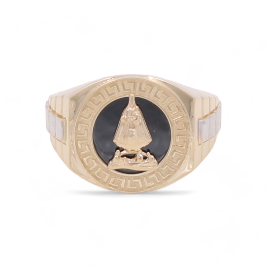 A luxury men's ring, the 14K Yellow and White Gold Men's Santa Barbara Ring by Miral Jewelry features a black circular centerpiece with an engraved triangular symbol and a Greek key pattern around the edge.