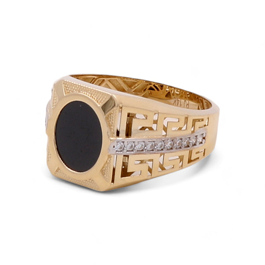 The Miral Jewelry 14K Yellow Gold Men Ring with Onyx Stone and Cubic Zirconias features a striking onyx stone centerpiece, flanked by intricate designs and a row of small clear cubic zirconias.