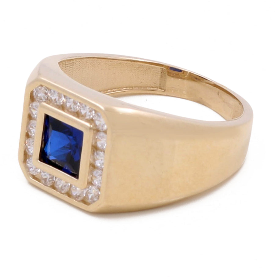 14K Yellow Gold Men's Sapphire and Cubic Zirconias Ring by Miral Jewelry featuring a square sapphire stone surrounded by small, dazzling cubic zirconias.