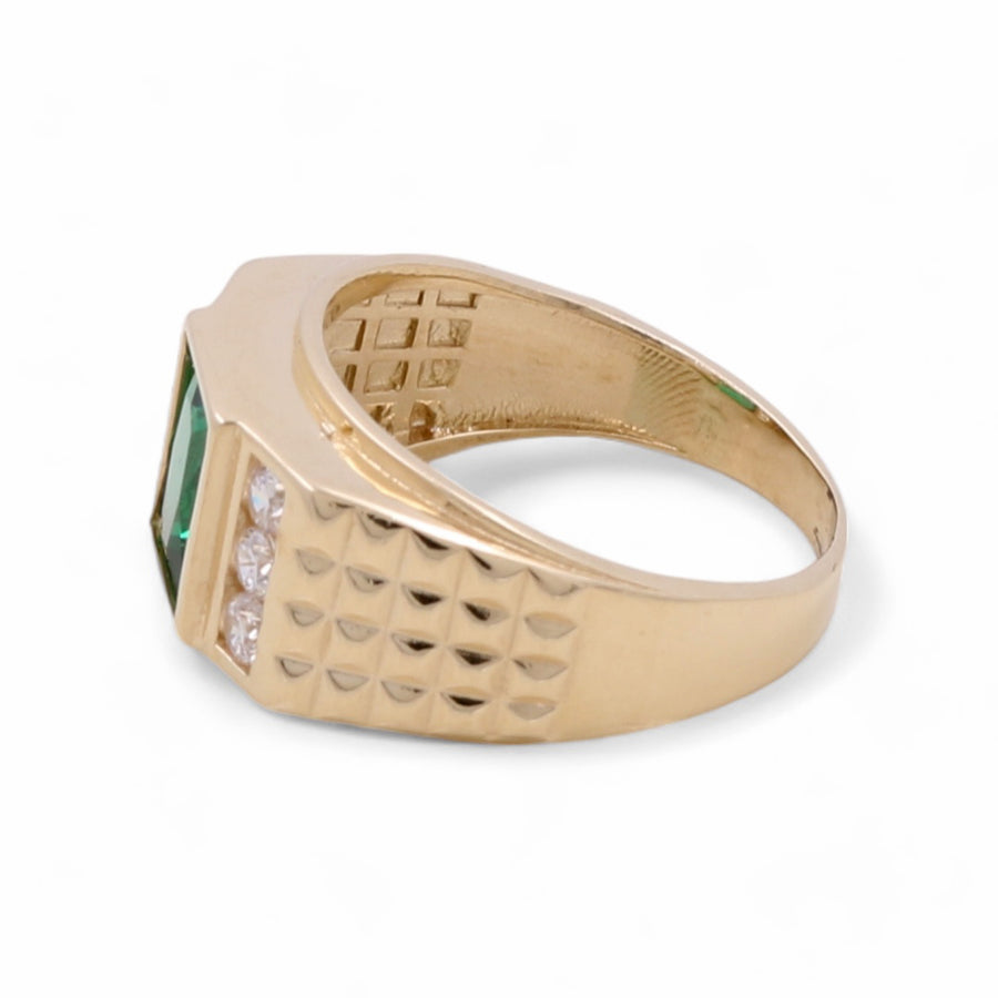 Miral Jewelry 14K Yellow Gold Men's Emerald and Cubic Zirconias Ring crafted in 14K yellow gold, featuring an emerald-cut green gemstone and small clear cubic zirconias set on one side of the textured band.