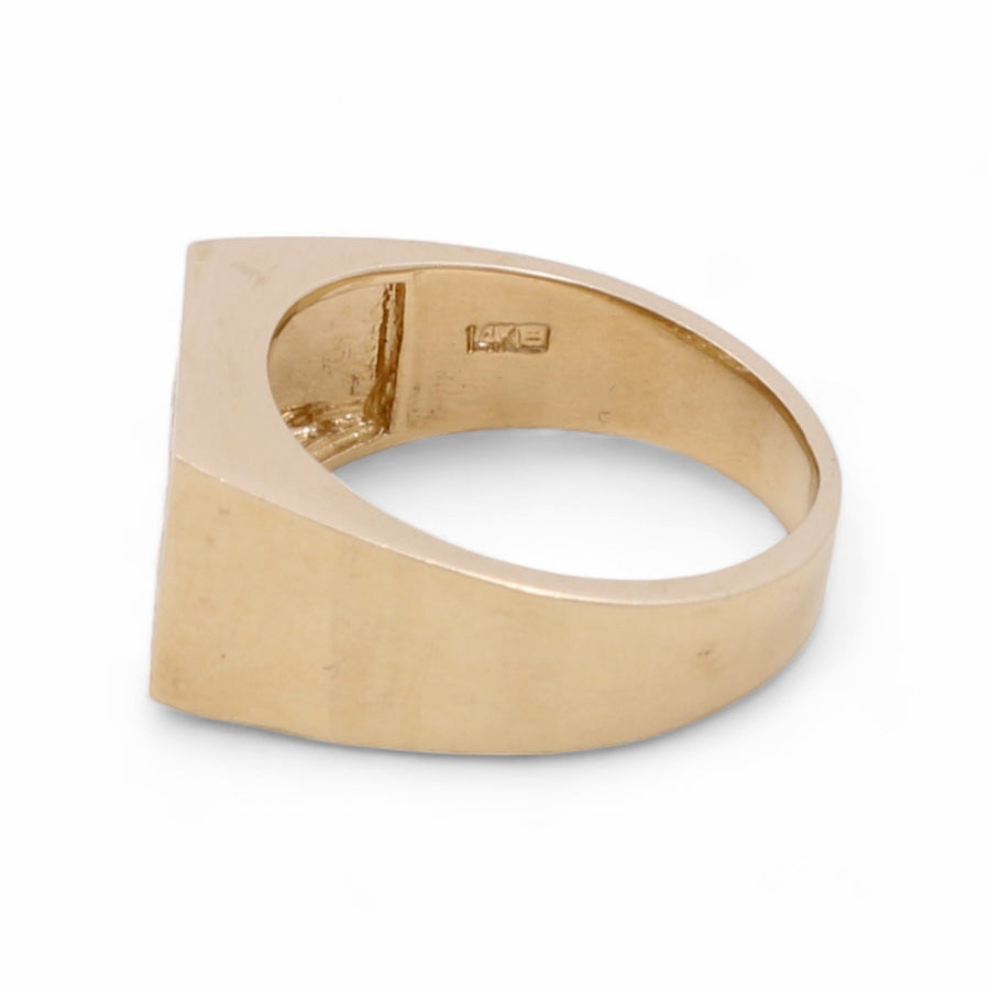 A Miral Jewelry 14K Yellow Gold Men's with Cubic Zirconias Ring with a square face and a 14K stamp on the inner band, exuding luxury and sophistication, set against a white background.