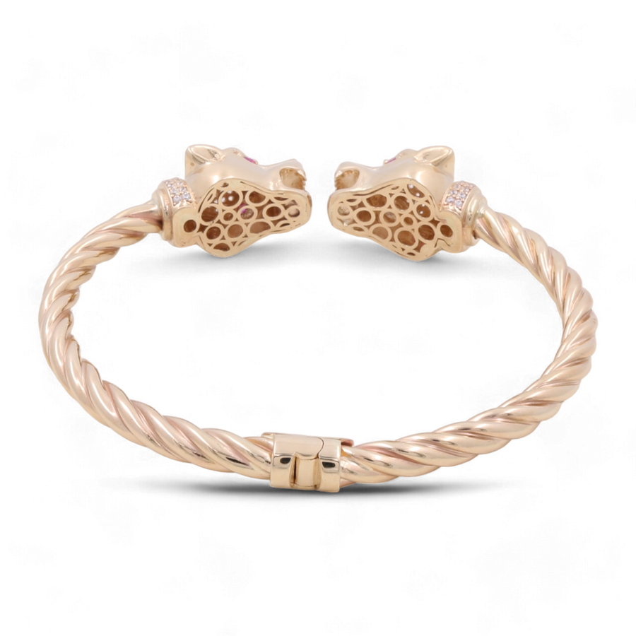 Miral Jewelry's 14K Gold Fashion Panther with Color Stones and Cubic Zirconias Bracelet features a striking twisted design, adorned with two leopard head ornaments at both ends that make it a standout statement piece.