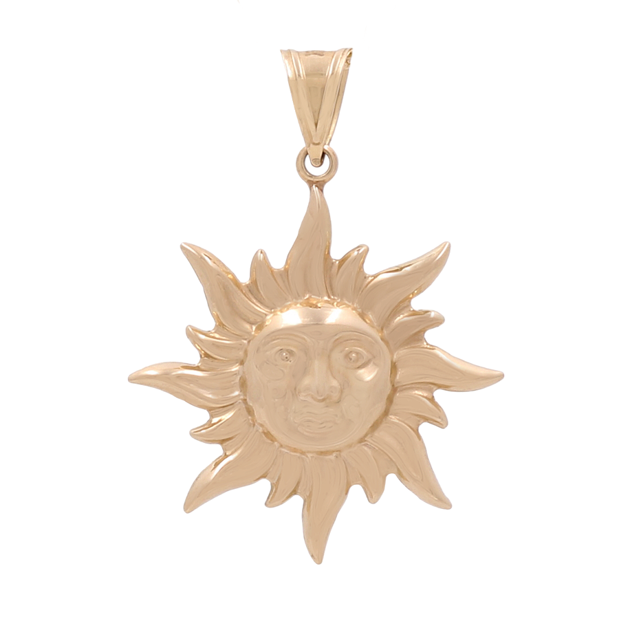 This captivating 14K Yellow Gold Sun Pendant by Miral Jewelry showcases a radiant sun-shaped design with a centered face and wavy rays extending outward, all accented with shimmering Cubic Zirconias—making it a breathtaking addition to any jewelry collection.