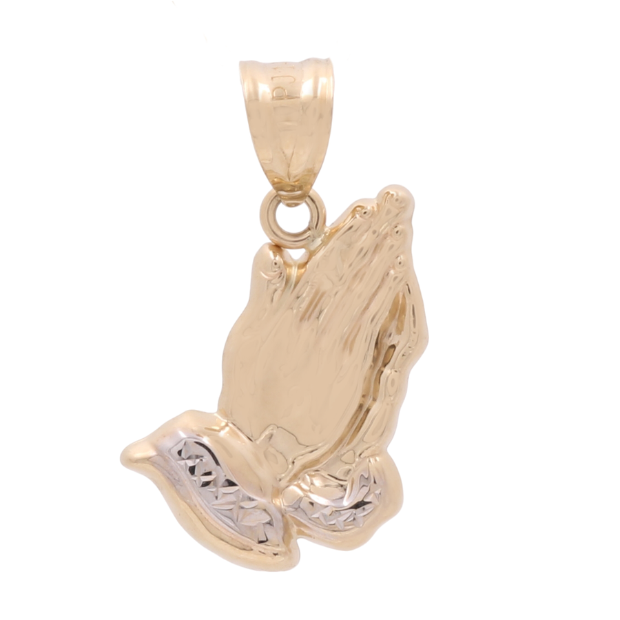 A 14K Yellow and White Gold Praying Hands Pendant from Miral Jewelry, symbolizing a profound symbol of faith with its yellow gold design and silver-colored accents at the wrist.