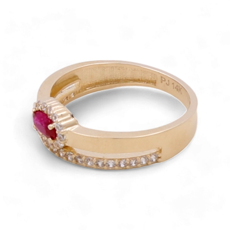 A stunning 14K yellow gold women's fashion ring from Miral Jewelry, featuring a central red gemstone flanked by small diamonds and a row of cubic zirconias along the shank, engraved with "PJ 14K.