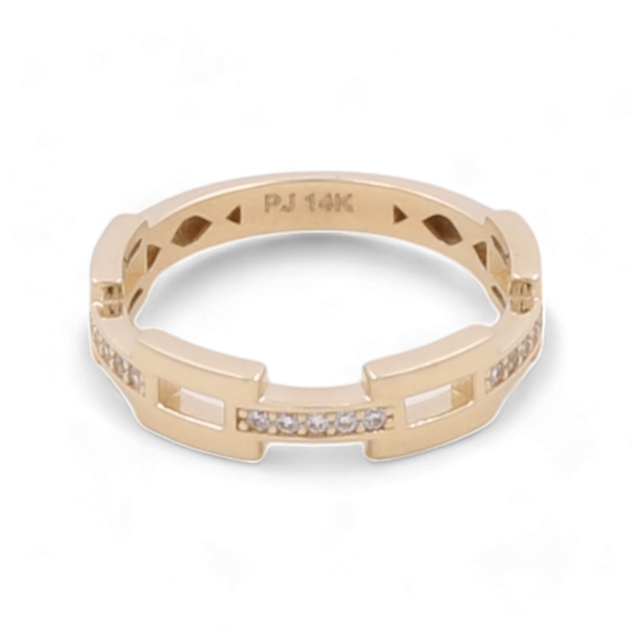 Fashion ring featuring a geometric design, encrusted with small cubic zirconias on the band. Engraved inside with "PJ 14K," this 14K yellow gold ring from Miral Jewelry offers both elegance and style.