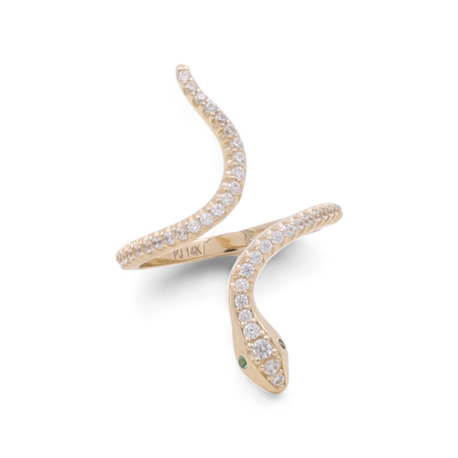 The 14K Yellow Gold Women's Snake with Color Stone Ring by Miral Jewelry showcases a captivating snake-shaped design adorned with cubic zirconias and highlighted by green color stone eyes, elegantly coiled in an open style.