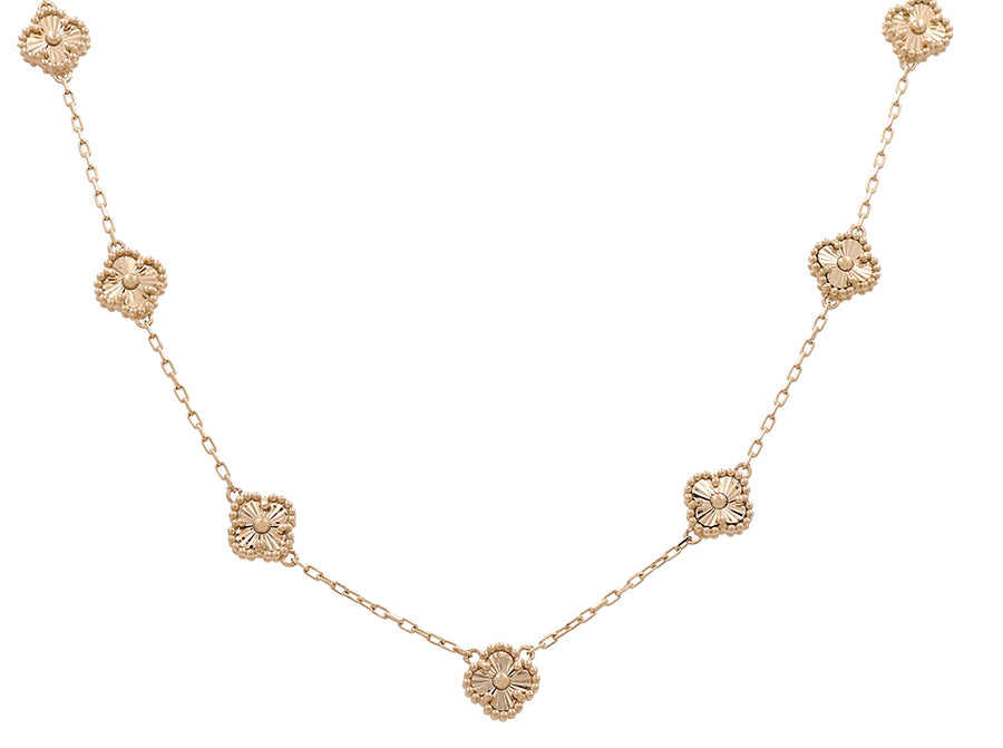 14K Yellow Gold Fashion 7 Flowers Necklace with ornate, floral-patterned links evenly spaced along the chain. This exquisite piece of fashion jewelry by Miral Jewelry beautifully showcases its intricate design, making it an elegant flowers necklace for any occasion.