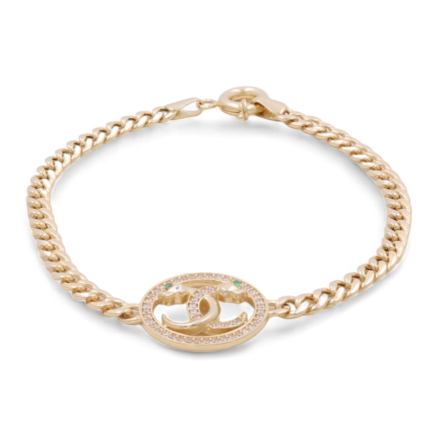 A 14K Gold Fashion Bracelet by Miral Jewelry featuring an oval pendant with a designer logo, embellished with colorful stones and cubic zirconias.