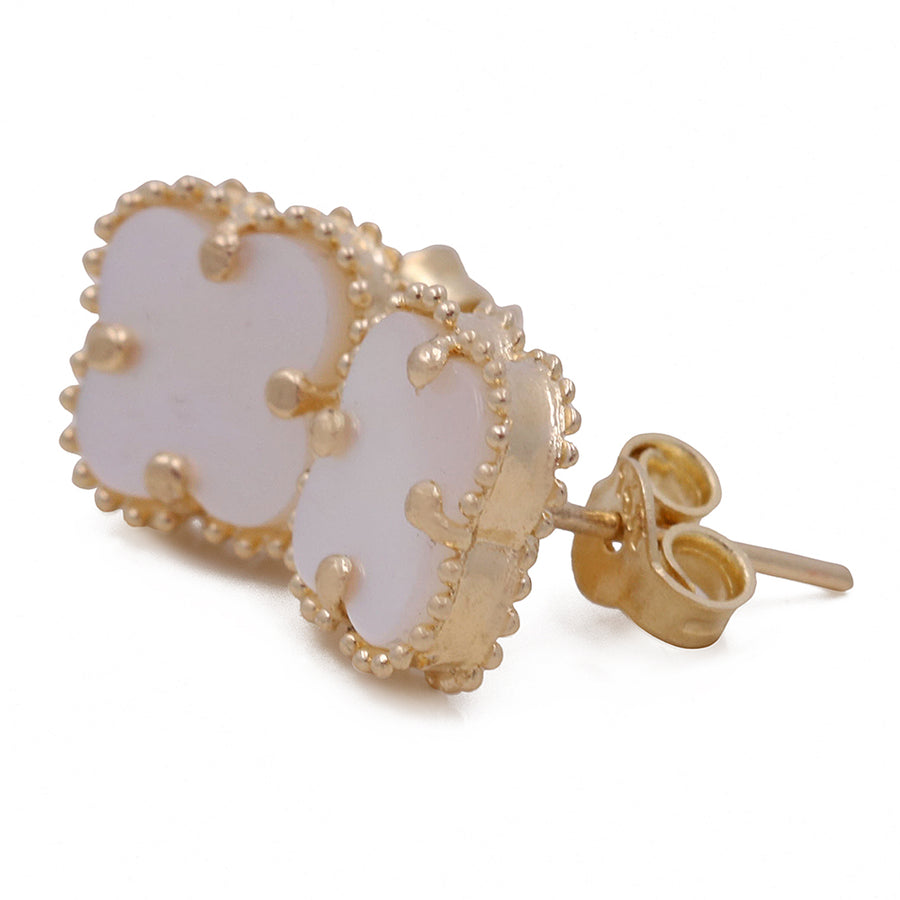 A 14K Yellow Gold Fashion Flower Women's Mother of Pearl Earring by Miral Jewelry featuring a mother of pearl clover-shaped stone with beaded trim detailing.