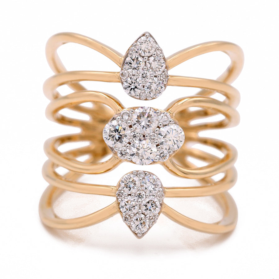 A Miral Jewelry Yellow Gold 14k Fashion Ring With Diamonds features three overlapping gold bands adorned with clusters of small diamonds, including teardrop-shaped diamonds on the top and bottom and an oval-shaped diamond in the middle.